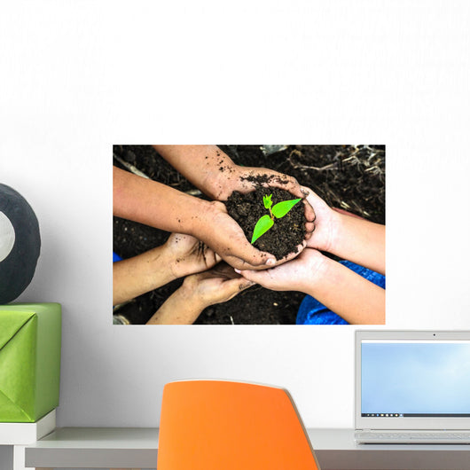 Child Holding Young Plant Wall Decal