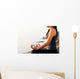 The woman meditating in a yoga pose on the tropical beach. Wall Mural