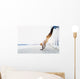 Young athlete is doing vertical push ups Wall Mural