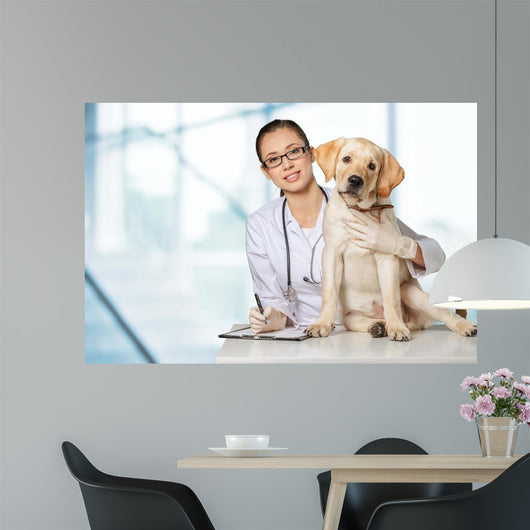 Veterinarian. Vet using technology with a little dog - isolated Wall Mural