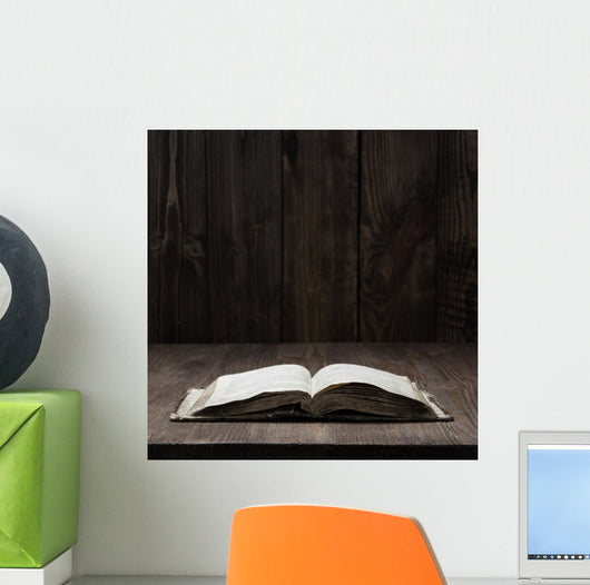 Image of an old  Holy Bible on wooden background on a wooden background in a dark space Wall Mural
