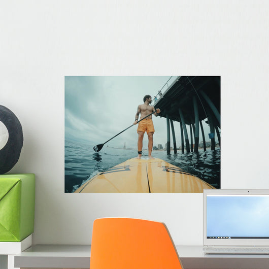 Surfer Paddles around Big Wall Decal