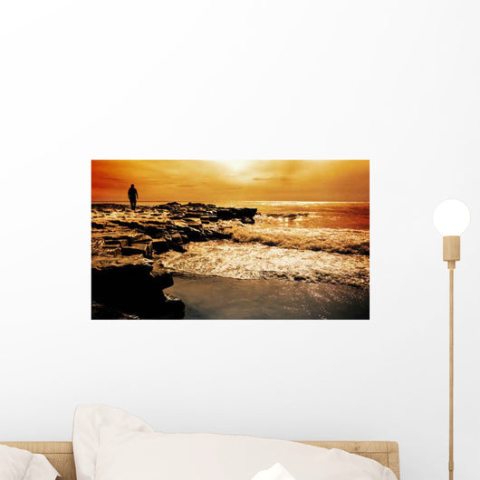 Man Walks Rocks Sea Wall Decal