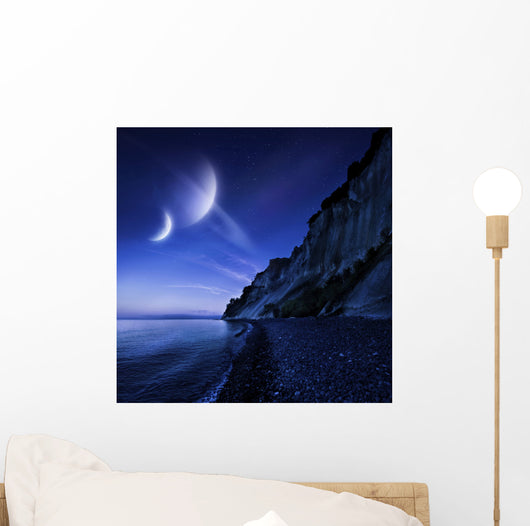 Two planets hover over a tranquil sea and Mons Klint cliffs, Denmark. Wall Mural