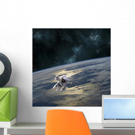 Astronaut Floating above Earth Wall Decal