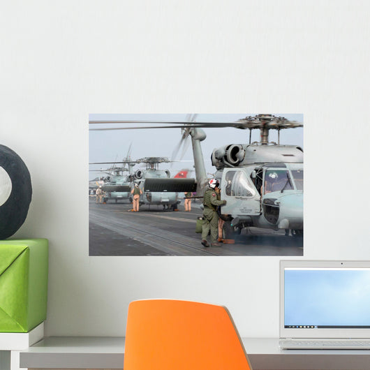 Helicopter Crews Change out Wall Decal