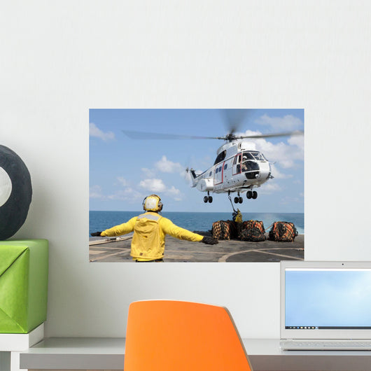 Sailors Attempt to Attach Wall Decal