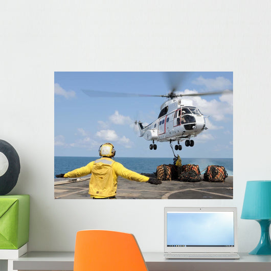 Sailors Attempt to Attach Wall Decal