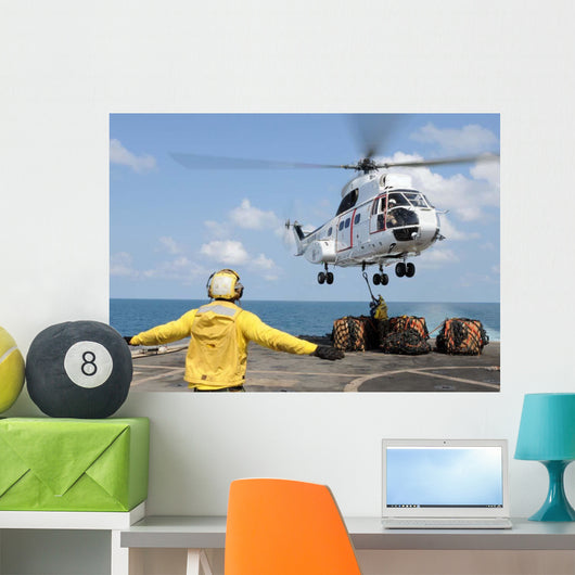 Sailors Attempt to Attach Wall Decal