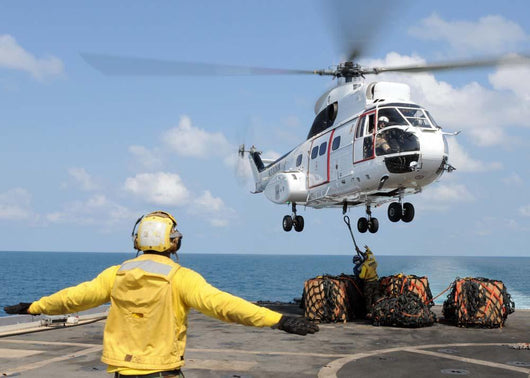 Sailors Attempt to Attach Wall Decal
