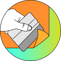 Applying a custom vinyl wall decal using a squeegie card. 