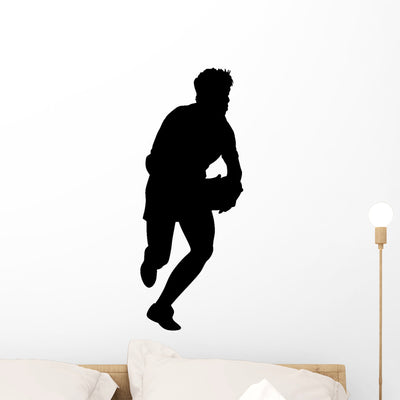 Running Rugby Wall Decal shown on a wall