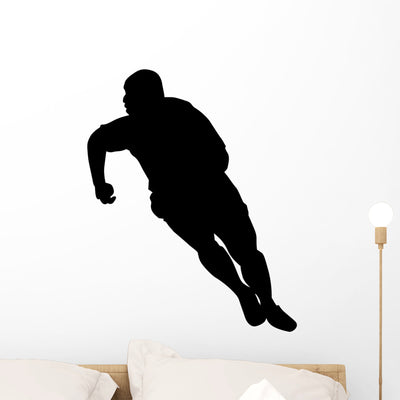 Rugby Runner Wall Decal shown on a wall