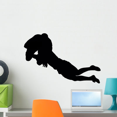 Tackling Football Players Wall Decal shown on a wall