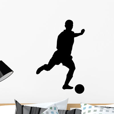 Soccer Silhouette Kicker Wall Decal shown on a wall