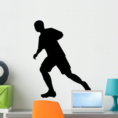 Sports Silhouette Soccer Wall Decal shown on a wall