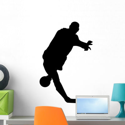 Black Soccer Silhouette Wall Decal shown on a wall