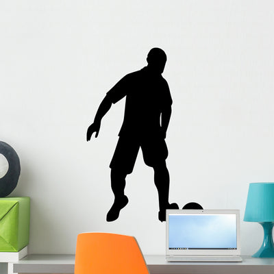 Black Silhouette Soccer Wall Decal shown on a wall