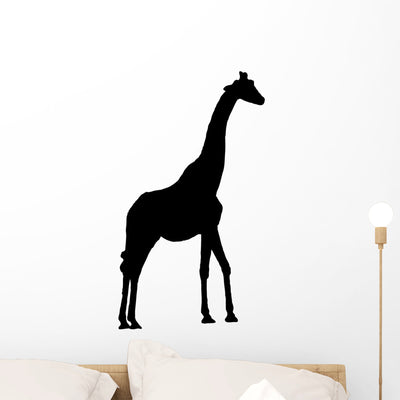 Tall Black Giraffe Wall Decal shown on a wall