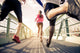 Joggers running outdoors Wall Mural