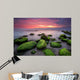 Green morning.
Rocky beach seascape at sunrise. Wall Mural
