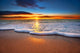 Sunrise light shining on ocean waves. Wall Mural