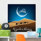Ramadan kareem with camel walks through in desert on night day Wall Mural