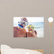 Happy senior couple with their diving mask at beach  Wall Mural