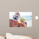 Happy senior couple with their diving mask at beach  Wall Mural