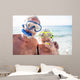 Happy senior couple with their diving mask at beach  Wall Mural