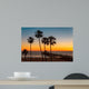Palm trees on the beach at sunset Wall Mural