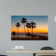 Palm trees on the beach at sunset Wall Mural