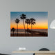 Palm trees on the beach at sunset Wall Mural