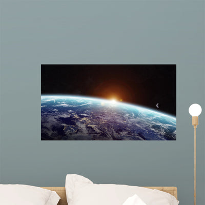 Sunrise over Planet Earth Wall Decal shown on a wall