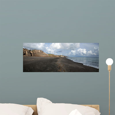 Black Beach Santorini Island Wall Mural shown on a wall