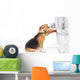 Veterinarian examining beagle dog Wall Decal