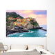 Colorful houses on a rock in Manarola, Cinque Terre, Italy Wall Mural