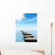 A row of stones in water with sun beam Wall Mural