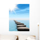 A row of stones in water with sun beam Wall Mural