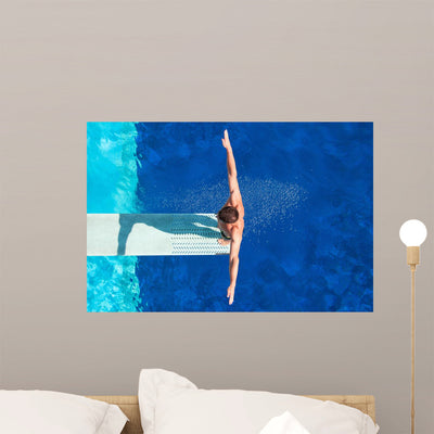 Diver Springboard Pool Wall Mural shown on a wall