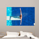 Diver on the springboard, ready to jump backwards Wall Mural