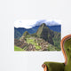 Machu Picchu is located in the Cusco Region of Peru, South America. It is situated on a mountain ridge above the Urubamba Valley in Peru, which is 80 kilometres (50 mi) northwest of Cusco  Wall Mural