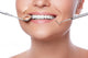Smiling woman and dental tools Wall Decal