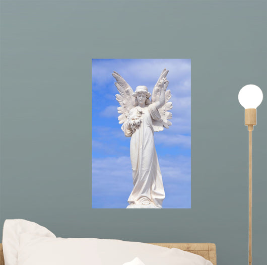 White angel grave yard statue with blue sky Wall Mural
