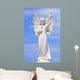 White angel grave yard statue with blue sky Wall Mural