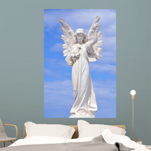 White angel grave yard statue with blue sky Wall Mural