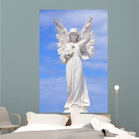 White angel grave yard statue with blue sky Wall Mural