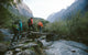 Group of trekkers cross the bridge Wall Mural