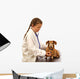 Child little girl playing doctor veterinarian with little dog. Wall Decal
