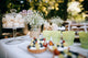 Delicious wedding reception candy bar Dessert table for a wedding outdoor party. Ombre cake, cupcakes, sweetness and flowers Wall Mural